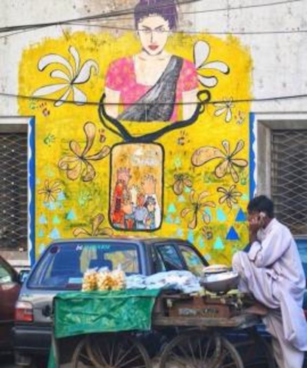 Mural on a street in Karachi depicting Pakistani social media celebrity Qandeel Baloch who was killed in 2016. 